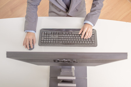 Businessman analyzing investment charts with computer. Accountingの写真素材