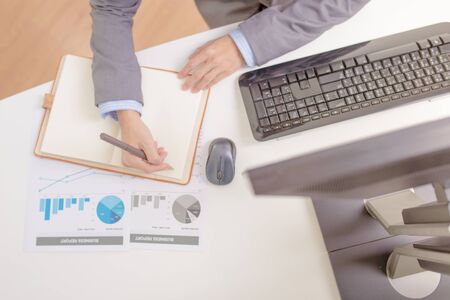 Businessman analyzing investment charts with computer. Accountingの写真素材