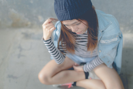 Young beautiful girl in abandoned houseの写真素材