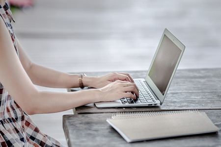 Young Caucasian woman using Laptop on nature