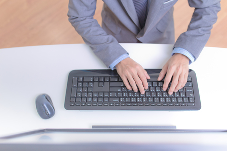 Businessman analyzing investment charts with computer. Accountingの写真素材