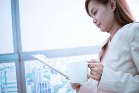Woman taking notes during business meeting in the office.の写真素材