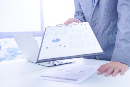 Businessman analyzing investment charts. Accountingの写真素材