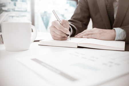 Businessman analyzing investment charts. Accountingの写真素材