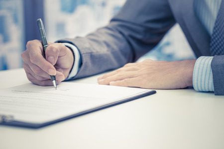 Business man signing a contractの写真素材