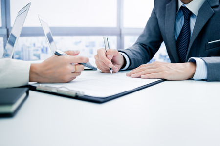 Business man signing a contractの写真素材