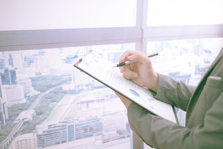 Businessman analyzing investment charts. Accountingの写真素材
