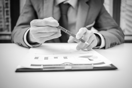Businessman analyzing investment charts. Accountingの写真素材