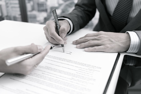 Business man signing a contractの写真素材