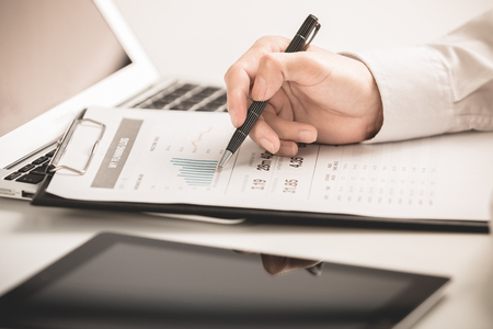 business report and man hand. Accountingの写真素材