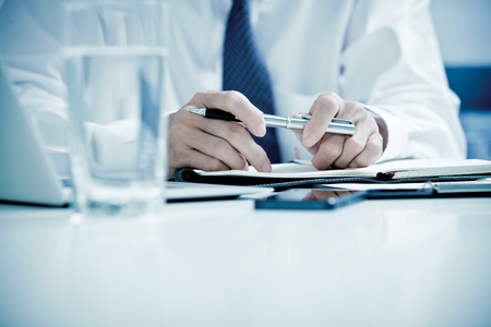 Businessman analyzing data in officeの写真素材