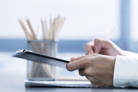 Businessman analyzing investment charts with laptop. Accountingの写真素材