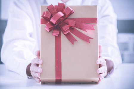 Business man offering a gift