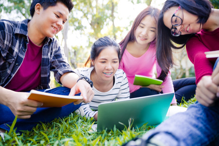 Group of university students having fun outdoorsの写真素材