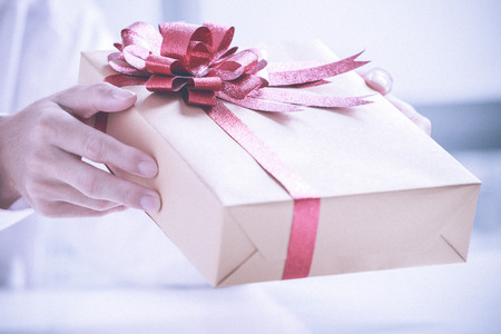 Business man offering a gift