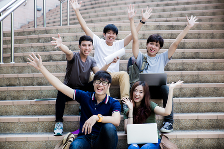 group of happy teen high school students outdoorsの写真素材