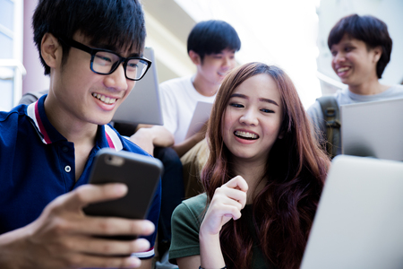 group of happy teen high school students outdoorsの写真素材