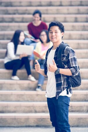 group of happy teen high school students outdoorsの写真素材