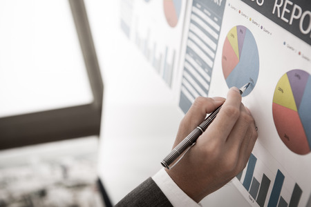 Businessman analyzing investment charts. Accountingの写真素材