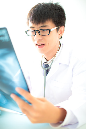 close up of male doctor holding x-ray or roentgen imageの写真素材