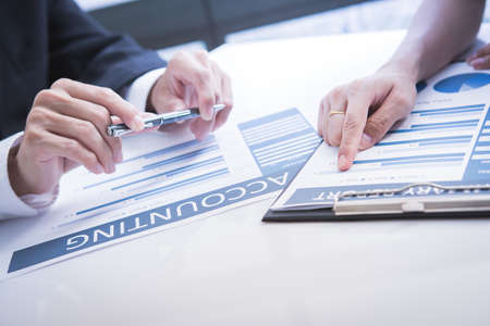 Business adviser analyzing financial figures denoting the progress in the work of the company