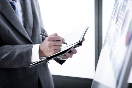 Businessman analyzing investment charts. Accountingの写真素材