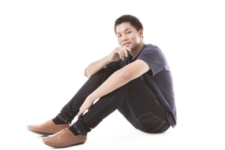 Young man isolated on white. Asian male modelの写真素材