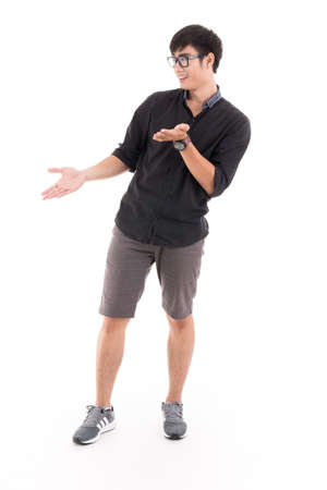 Young man pointing empty copy space isolated on white. Asian male modelの写真素材