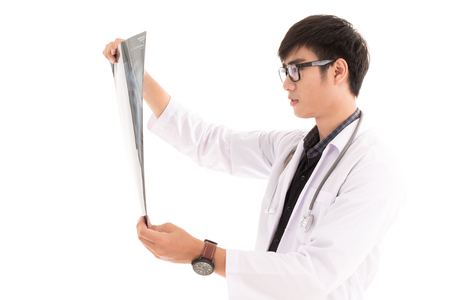Young asia doctor check x-ray isolated on white. Asian male modelの写真素材