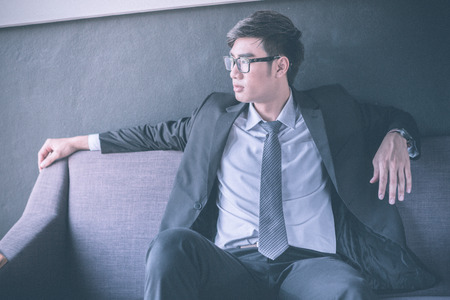 Businessman sitting on sofa