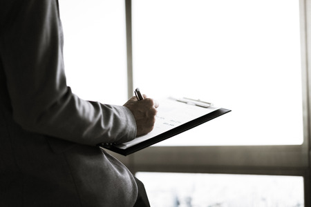 Businessman analyzing investment charts. Financial Report Revenue Statistical Accounting Concept