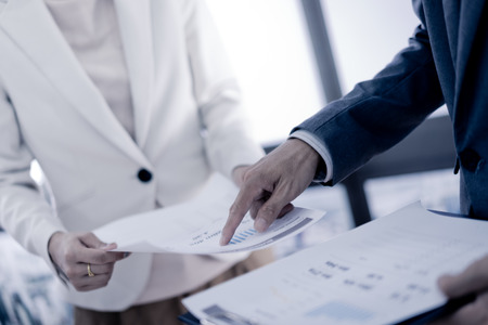 Business adviser analyzing financial figures denoting the progress in the work of the company