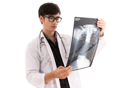 Young asia doctor check x-ray isolated on white. Asian male modelの写真素材