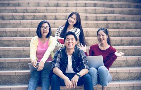 group of happy teen high school students outdoorsの写真素材