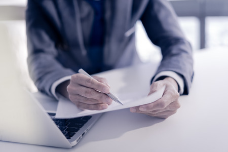 Businessman analyzing investment charts. Financial Report Revenue Statistical Accounting Conceptの写真素材