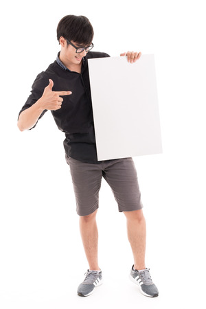 Male student holding a white board against white background. Asian male modelの写真素材