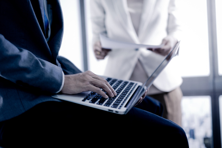 Business adviser analyzing financial figures denoting the progress in the work of the companyの写真素材
