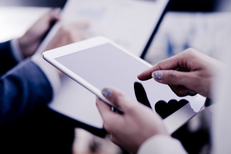 Business adviser analyzing financial figures denoting the progress in the work of the companyの写真素材