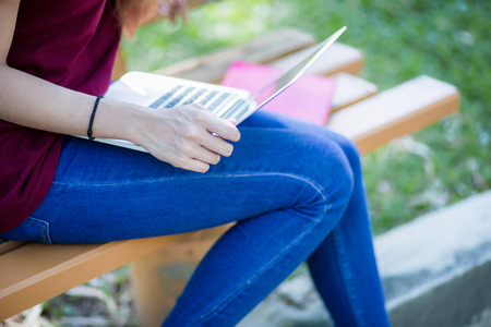 Group of students sharing with the ideas on the campus lawnの写真素材