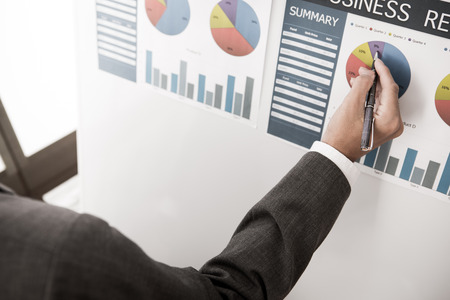 Businessman analyzing investment charts. Accountingの写真素材