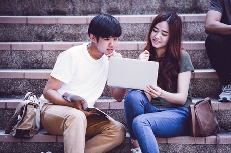 group of happy teen high school students outdoorsの写真素材