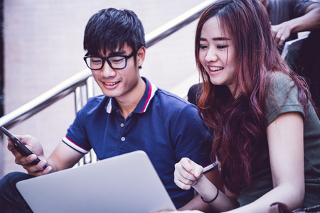 group of happy teen high school students outdoorsの写真素材