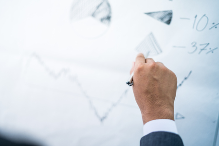 Businessman analyzing investment charts. Accountingの写真素材