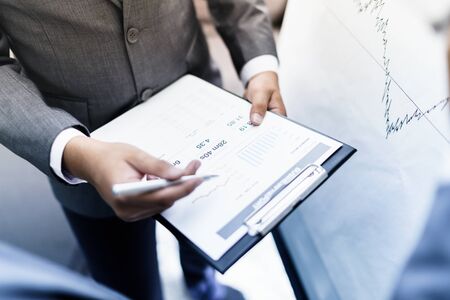 two young businessmen discussing project at meetingの写真素材