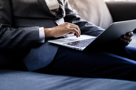 Businessman analyzing investment charts with laptop. Accountingの写真素材