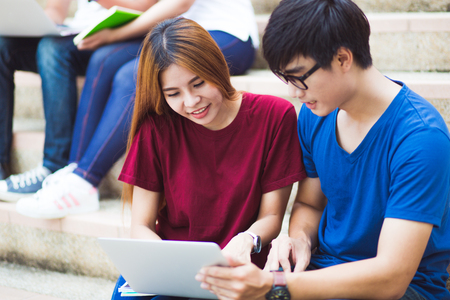 group of happy teen high school students outdoorsの写真素材