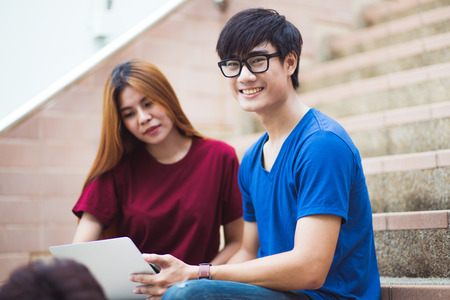 group of happy teen high school students outdoorsの写真素材