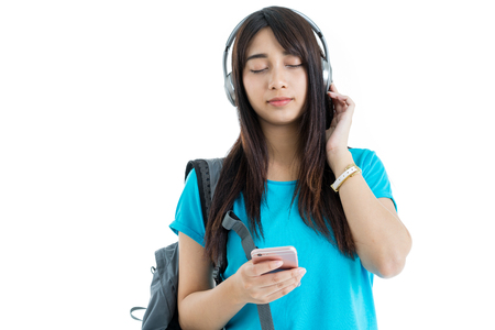 Young Asian student isolated on white background.の写真素材