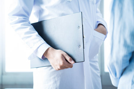 Doctor explaining for patient at consulting roomの写真素材