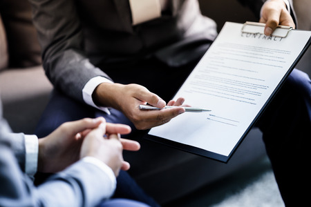 Business man signing a contractの写真素材